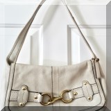H13. Coach bone colored bag with brass buckle. 8”h - $48